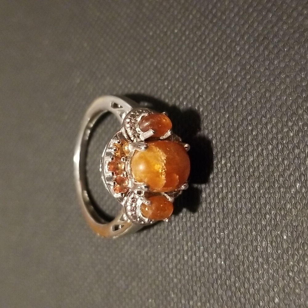 Sterling silver ring with orange stones